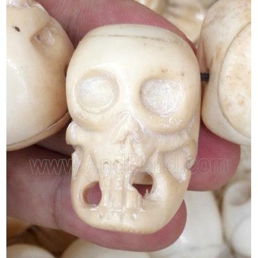 antique cattle bone beads, skull, yellow