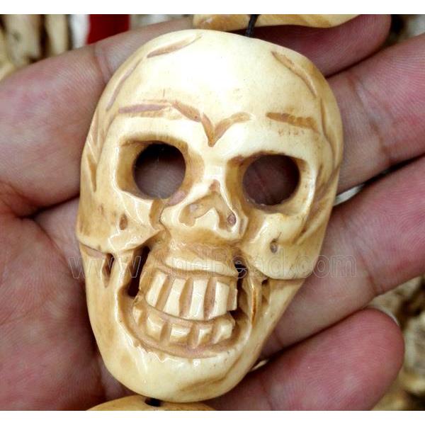 antique cattle bone beads, skull, yellow