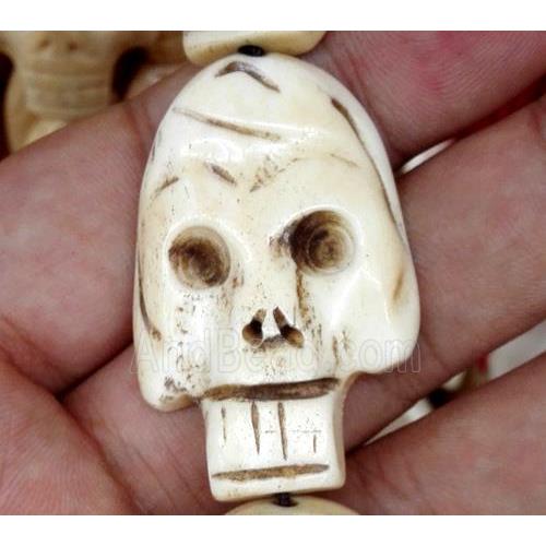 white antique cattle bone beads, skull