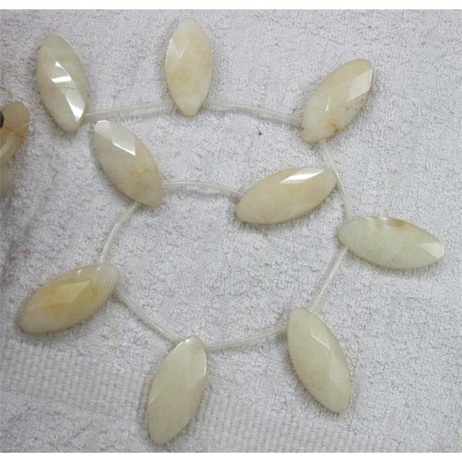 yellow jade bead, faceted flat-oval