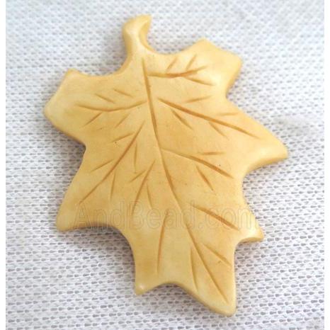 yellow cattle bone pendant, maple leaf