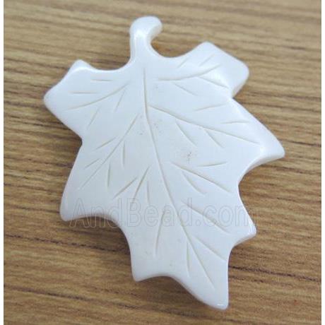 white cattle bone pendant, maple leaf