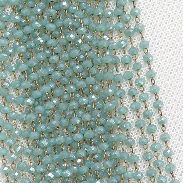 raw brass chain with blue crystal glass
