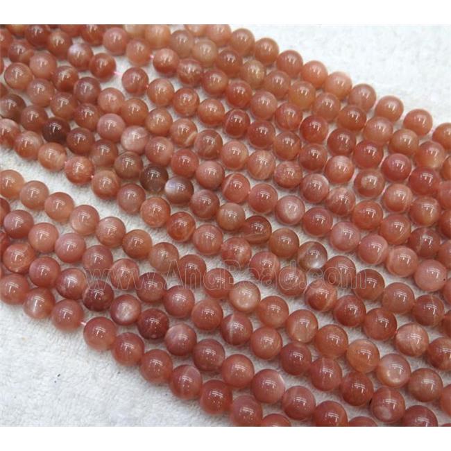 Sunstone beads, round, AAA-grade