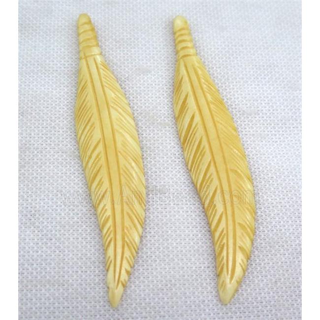 yellow bone feather pendant
