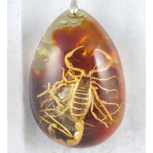 Amber teardrop pendant with scorpion, orange, NR