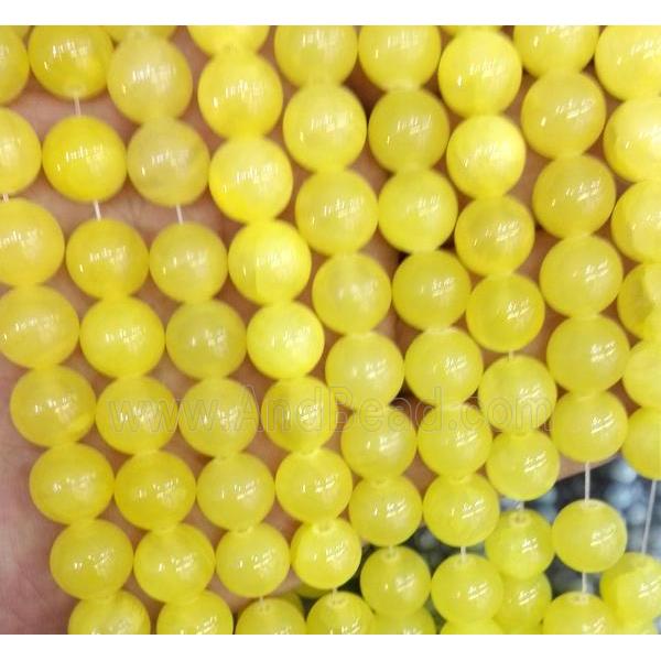 yellow jade bead, round, stabile