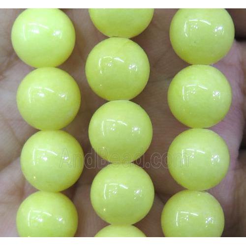 yellow jade bead, round, stabile